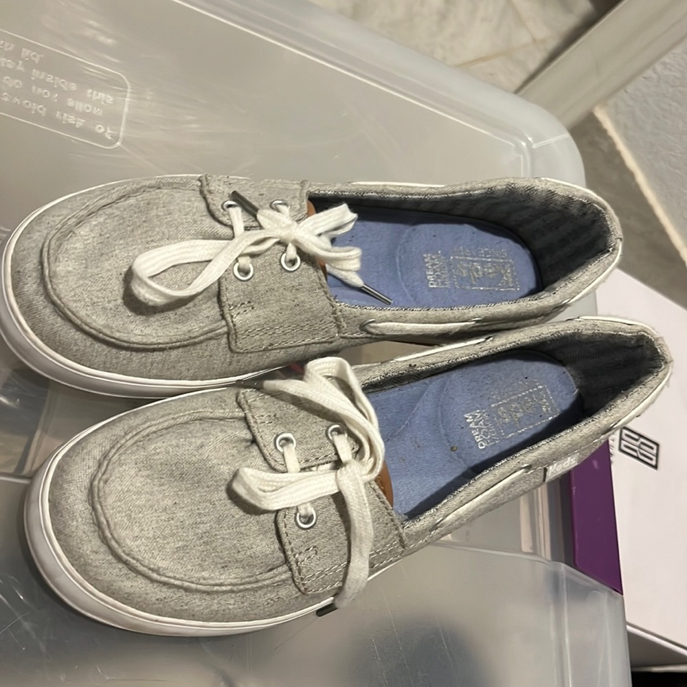 Keds silver shoes.